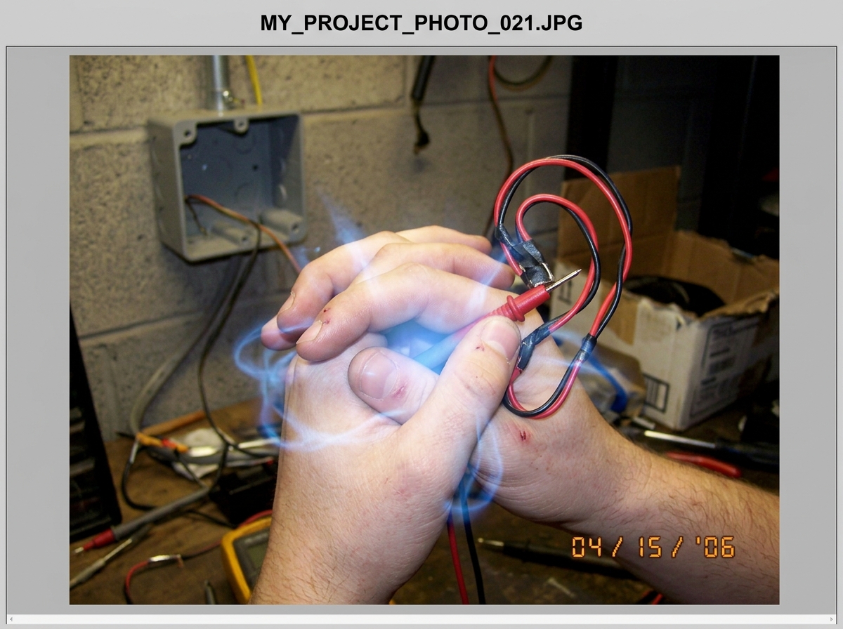 a close up photo of two hands fused together by a glowing blue spiritual energy, holding multimeter probes that are bent into the shape of an ear, with a junction box in the background