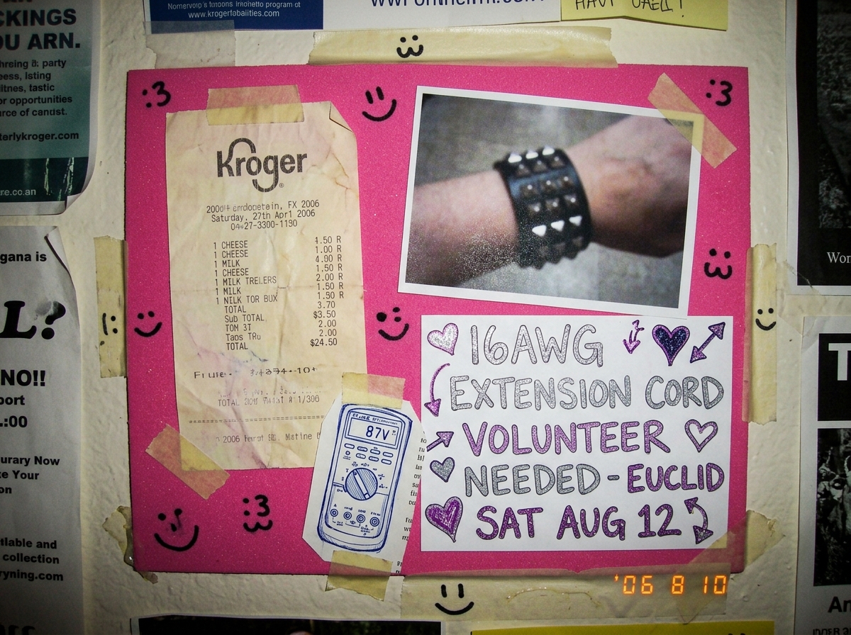 Shrine collage: a crumpled Kroger cheese receipt glued to pink craft foam next to a blurry 2003 cuff photo, a tiny hand-drawn Fluke 87V icon cut from a magazine page, and a glitter pen note reading '16AWG EXTENSION CORD VOLUNTEER NEEDED - EUCLID SAT AUG 12' with hearts and arrows, scattered smiley f