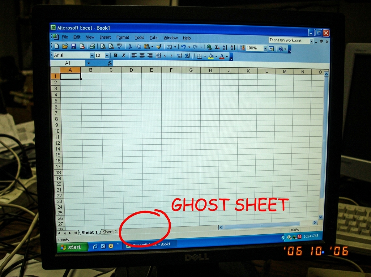 A screenshot of Microsoft Excel showing a workbook with only two sheet tabs at the bottom: 'Sheet 1' and 'Sheet 2'. There is no Sheet 3. A red MS Paint circle highlights the empty space where Sheet 3 would be if it existed, with 'GHOST SHEET' written in Comic Sans. The formula bar is empty.
