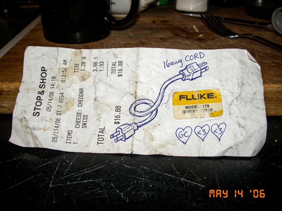 A crumpled cheese receipt with a doodle of a 16awg extension cord drawn in pen, alongside a tiny Fluke multimeter sticker and three little hearts labeled 'GC <3 <3'