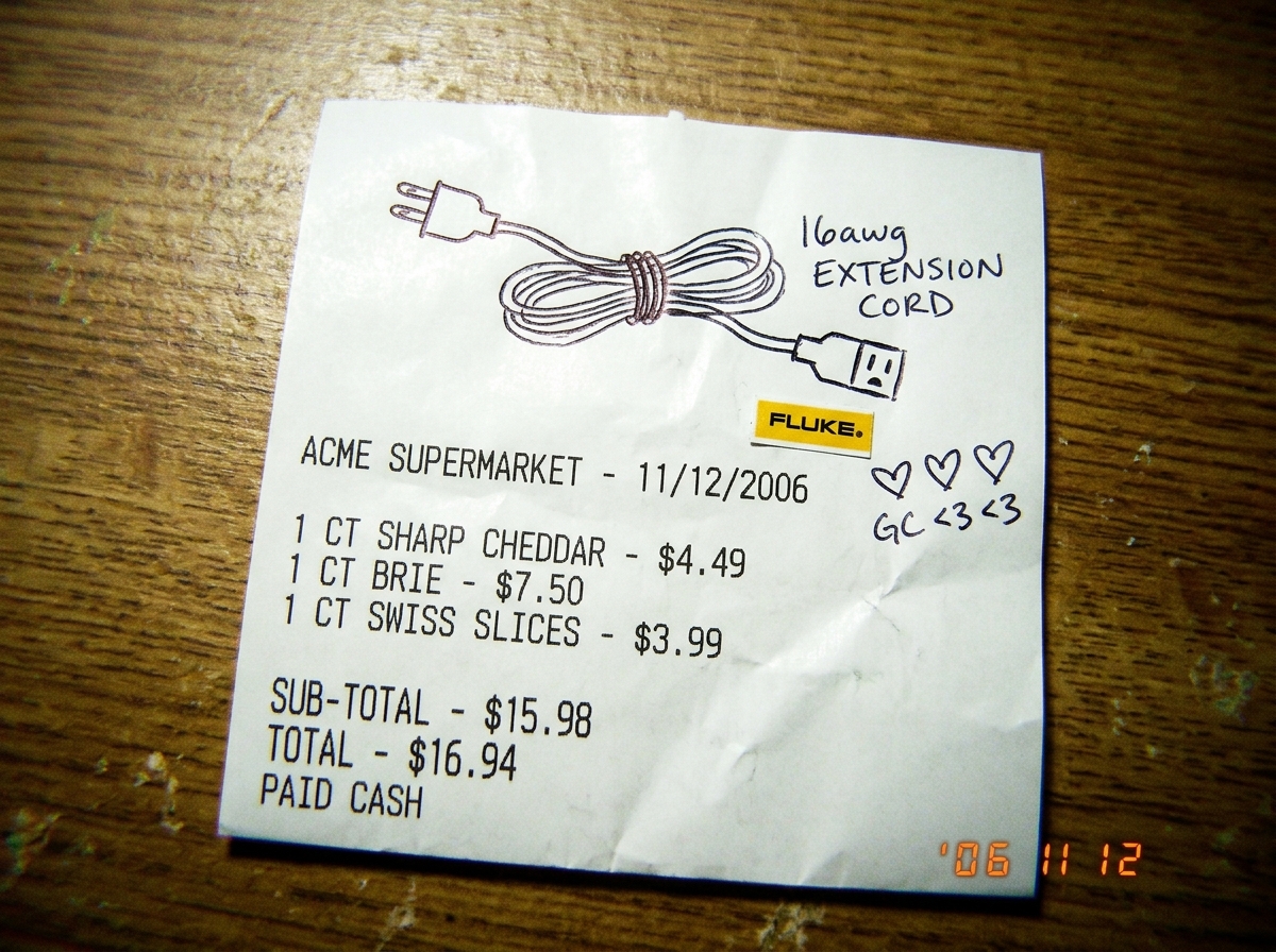 A crumpled cheese receipt with a doodle of a 16awg extension cord drawn in pen, alongside a tiny Fluke multimeter sticker and three little hearts labeled 'GC <3 <3'