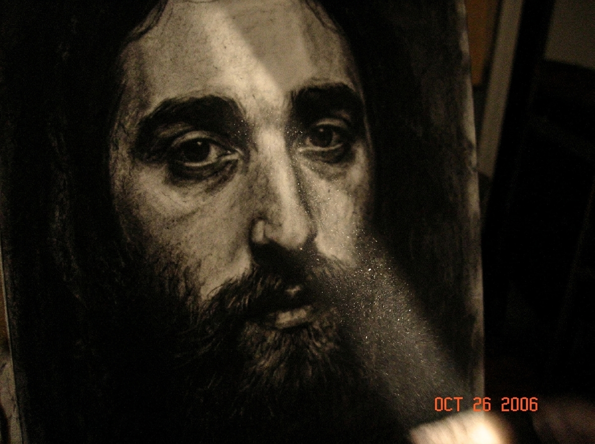 dark charcoal portrait of Gabriel Chantayan's face, the eyes drawn with intense shadow and texture, charcoal dust flying in a single ray of light