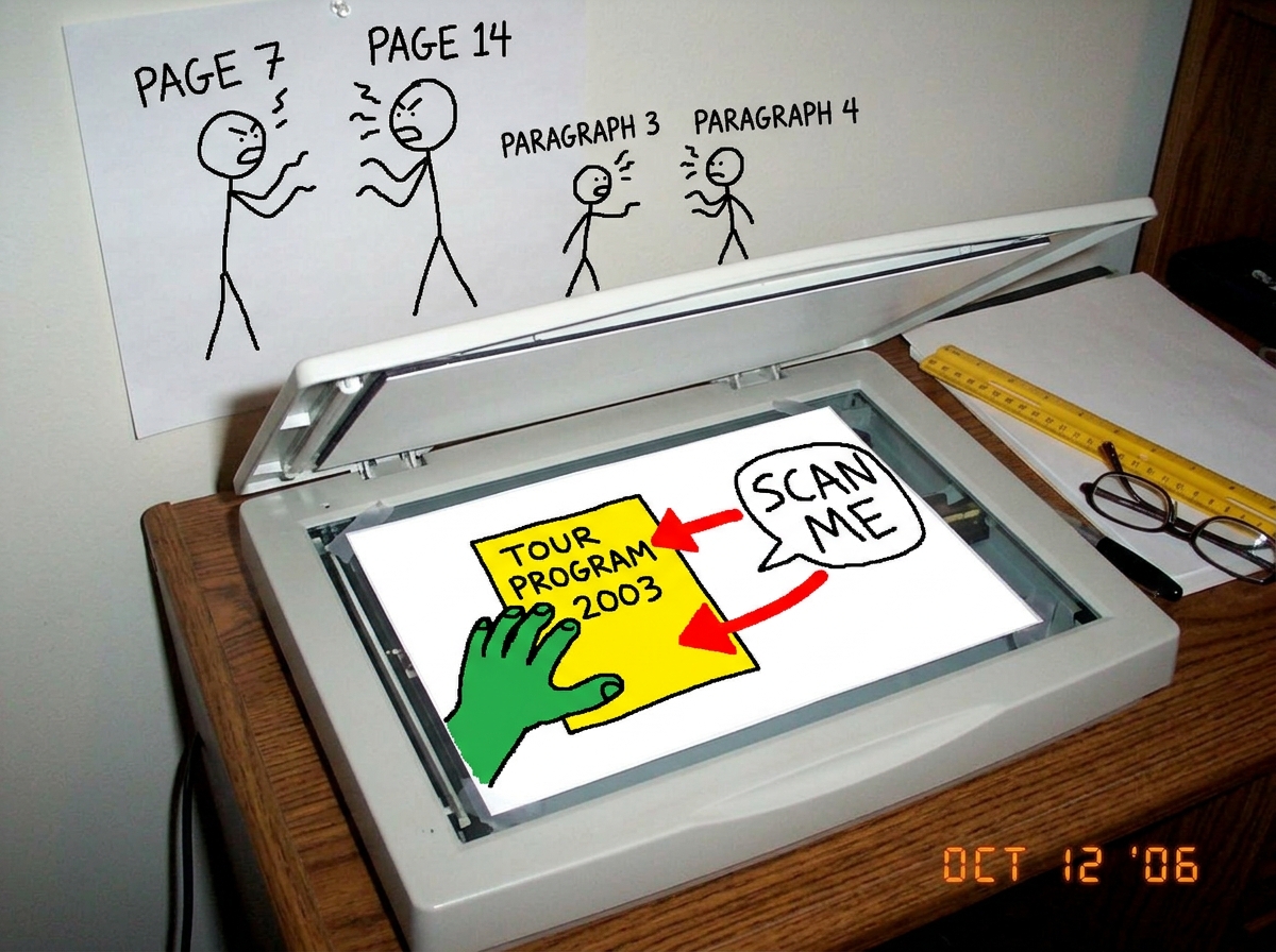 A crudely drawn MS Paint image of a hand holding a 2003 tour program insert flat on a scanner bed with the lid open, with red arrows pointing from the insert to a speech bubble saying 'SCAN ME' while in the background stick figures are arguing and labeled 'PAGE 7' 'PAGE 14' and 'PARAGRAPH 3' 'PARAGR
