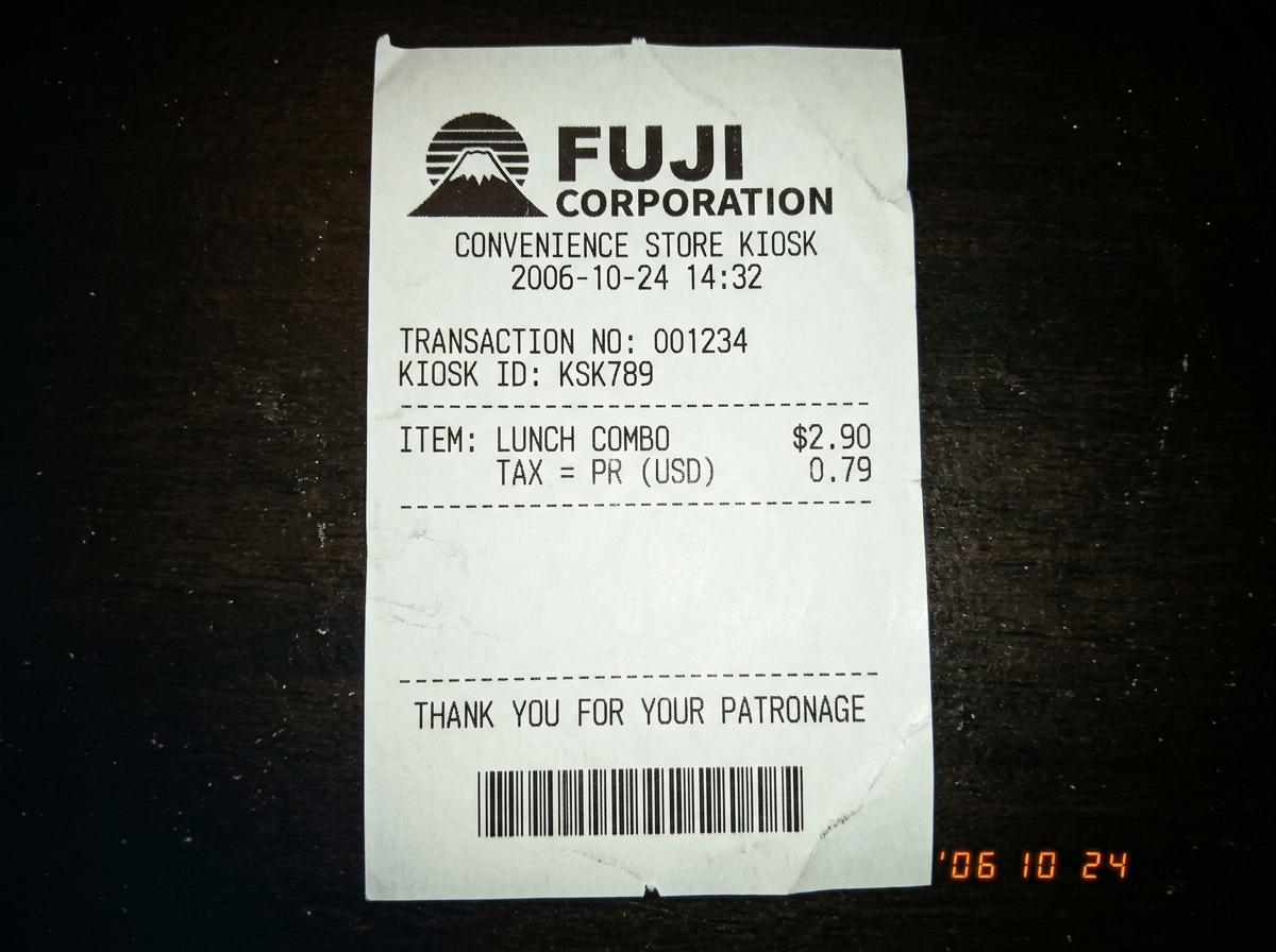 Thermoprinted receipt on Fuji 88x58mm thermal paper from a convenience store kiosk, showing a blank section and the Fuji Corporation logo, scanned in high resolution