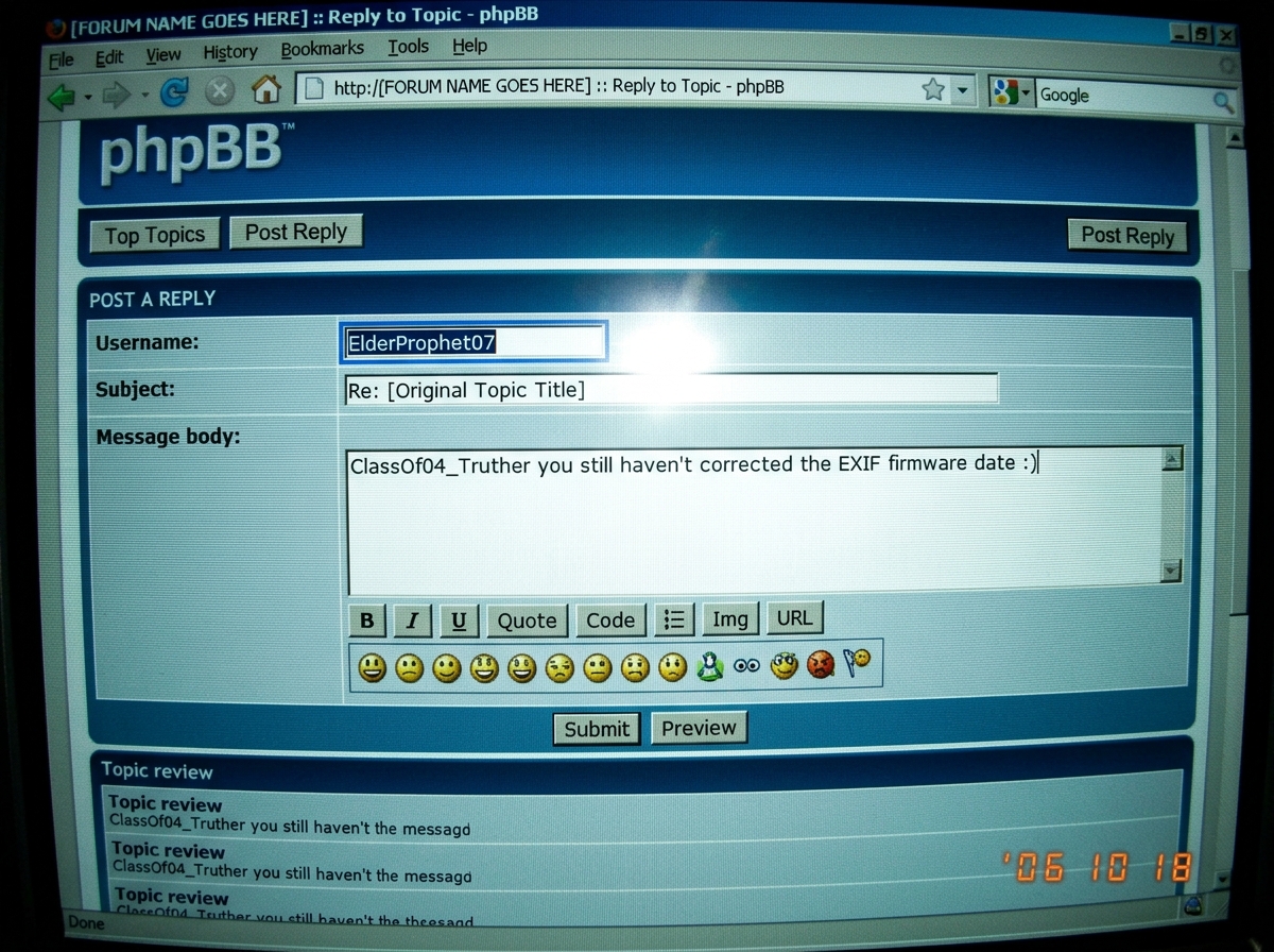 A screenshot of a reply thread interface on a phpBB forum circa 2006. The username ElderProphet07 is highlighted in the post preview box. The text reads: 'ClassOf04_Truther you still haven't corrected the EXIF firmware date :)' The forum theme is dark blue with gradient header. The screenshot has be