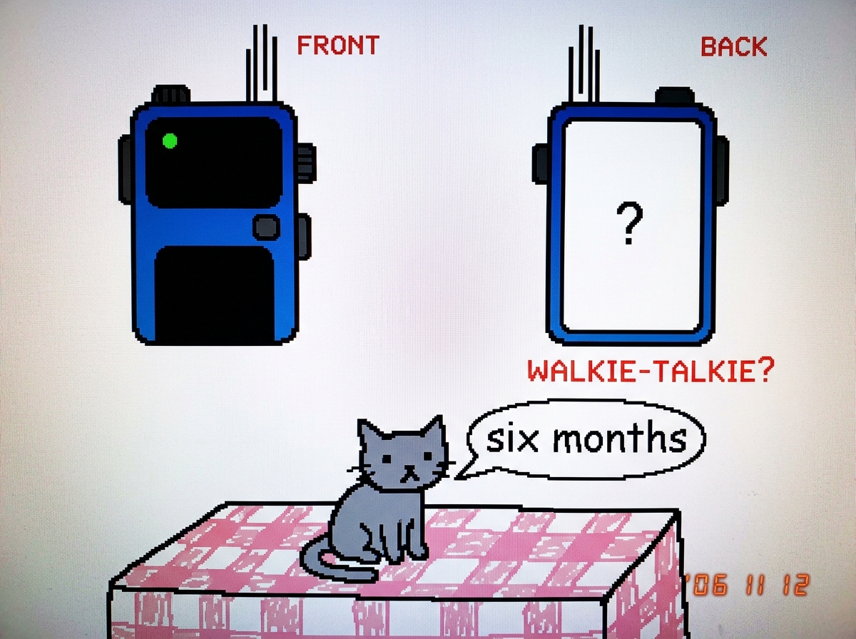A crude MSPaint drawing of a walkie-talkie from the front with a glowing green LED, and next to it the same walkie-talkie from the back showing the battery compartment door, but the back panel is blank white with a question mark in the center. Below the two drawings, a small gray cat sits on a table