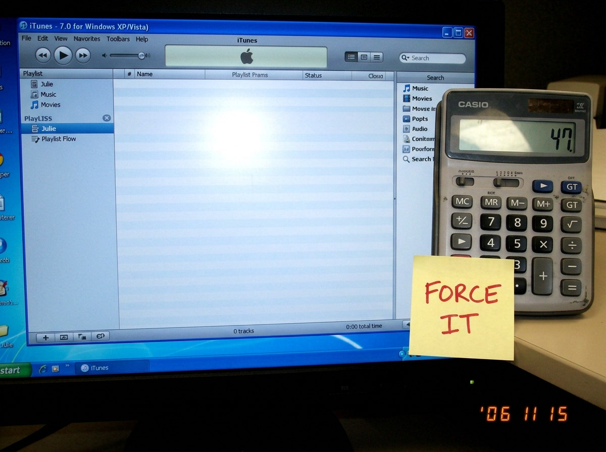 A screenshot of a blank iTunes playlist titled 'Julie' with zero tracks, next to a calculator showing the number 47. The calculator screen has a sticky note that says 'FORCE IT' in red marker.