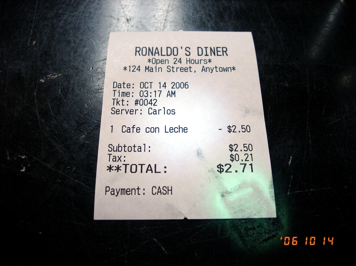 Thermal paper receipt from 'Ronaldo's Diner' showing purchase of 'cafe con leche' at 3:17 AM. In the corner there is a faint green smudge - the walkie talkie glow pressed against the counter while Carlos waited.