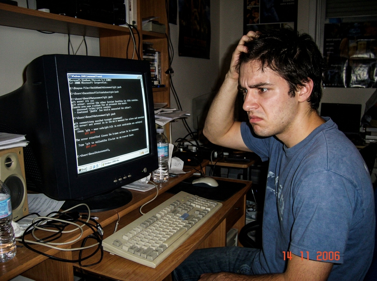 a meme image showing a person looking confused at a computer screen with the text 'git push' written on it
