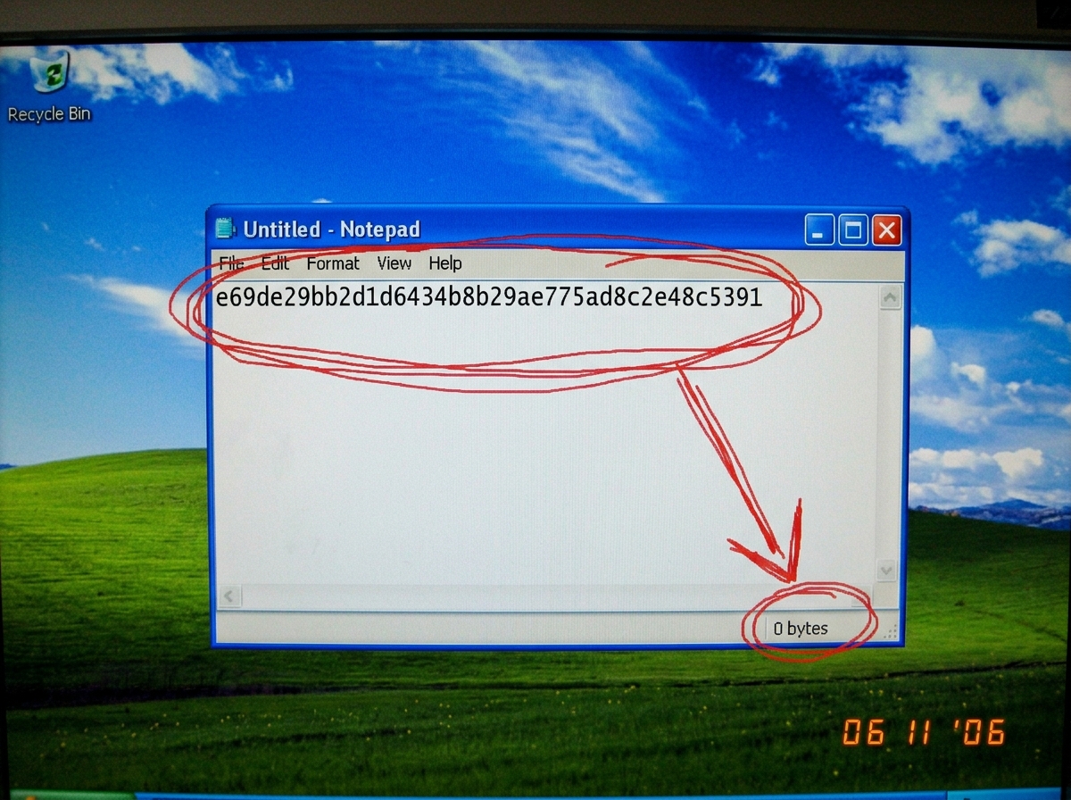 A screenshot from the Windows Notepad application showing a single line of text: 'e69de29bb2d1d6434b8b29ae775ad8c2e48c5391'. The Notepad is in classic XP style, blue title bar, on a default XP green hills desktop. Circled in red marker pen scrawl is the hash, with an arrow pointing to the file size 