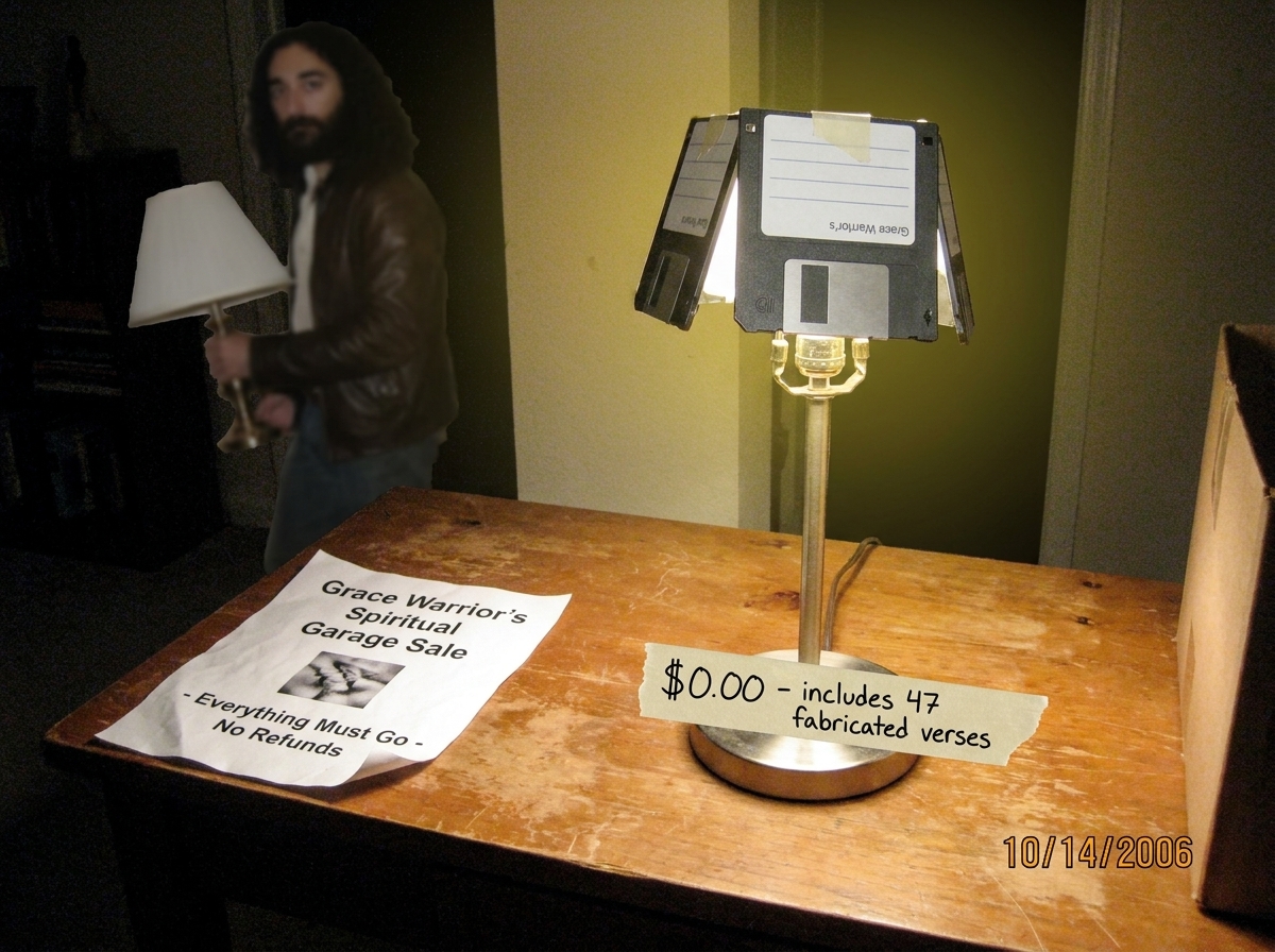 A badly photoshopped image of a yard sale table. On the table sits a single lamp with a floppy disk as its lampshade. Taped to the lamp's base is a handwritten sign reading '$0.00 - includes 47 fabricated verses'. The flyer on the table says 'Grace Warrior's Spiritual Garage Sale - Everything Must G
