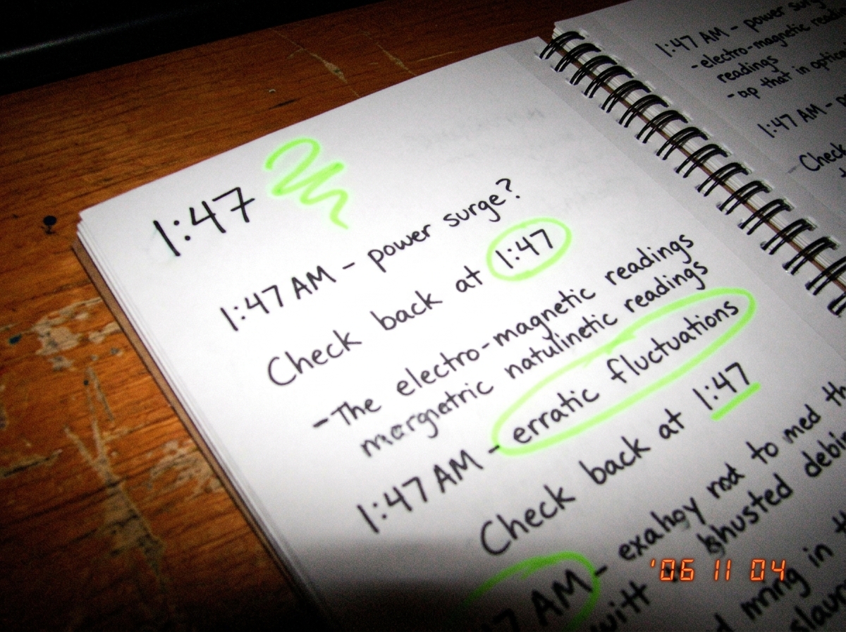 Alexei's notebook page showing 1:47 timestamps and squiggly green glow symbols, scanned on his phone