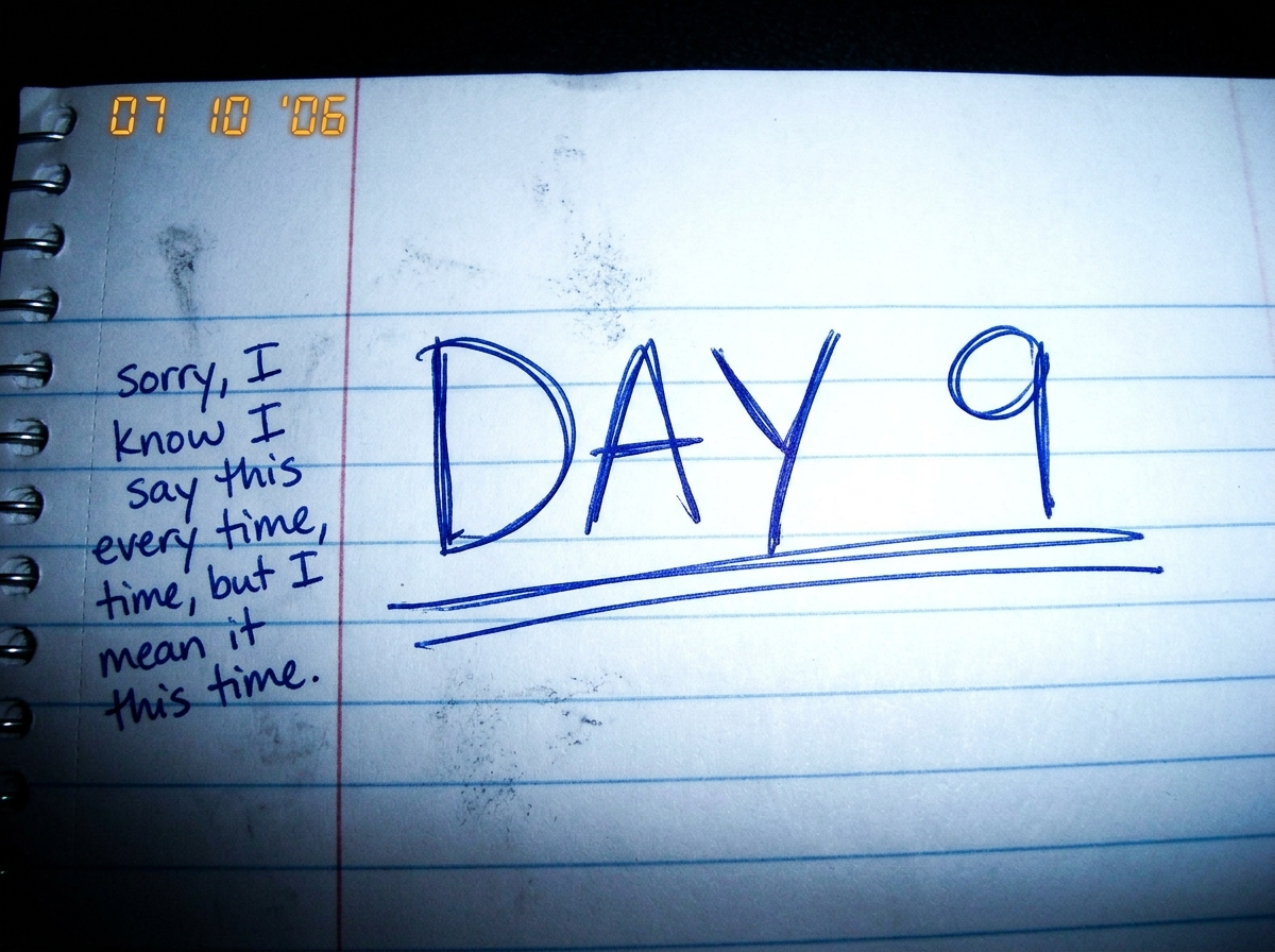 a close-up photo of a notebook page, with the words 'DAY 9' underlined twice in blue ink, and a smaller handwritten note in the margin that says 'sorry, I know I say this every time, but I mean it this time.'